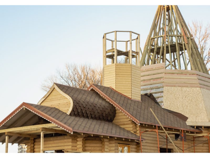 Large roof structure undergoing exterior maintenance