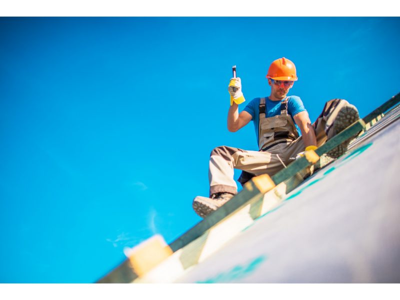 Roofing worker building a pitched residential roof